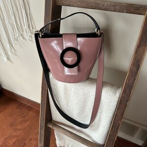 Les Petits Jouers pink and black bucket crossbody.